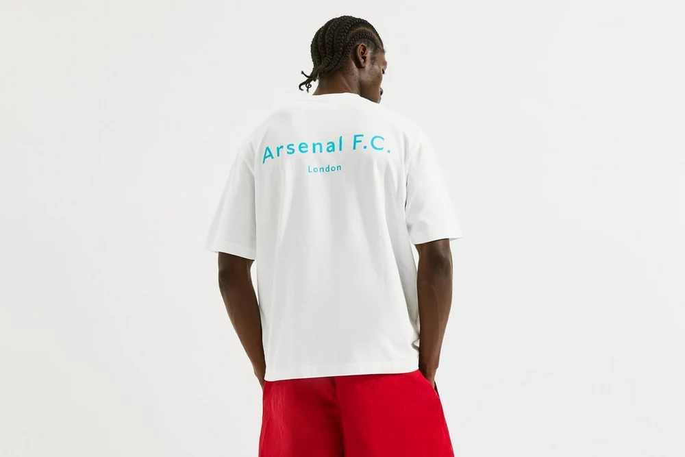Arsenal Fanshop Store - Arsenal Unisex Chapman T-Shirt in Weiß Offizielle Arsenal FC Fußballbekleidung