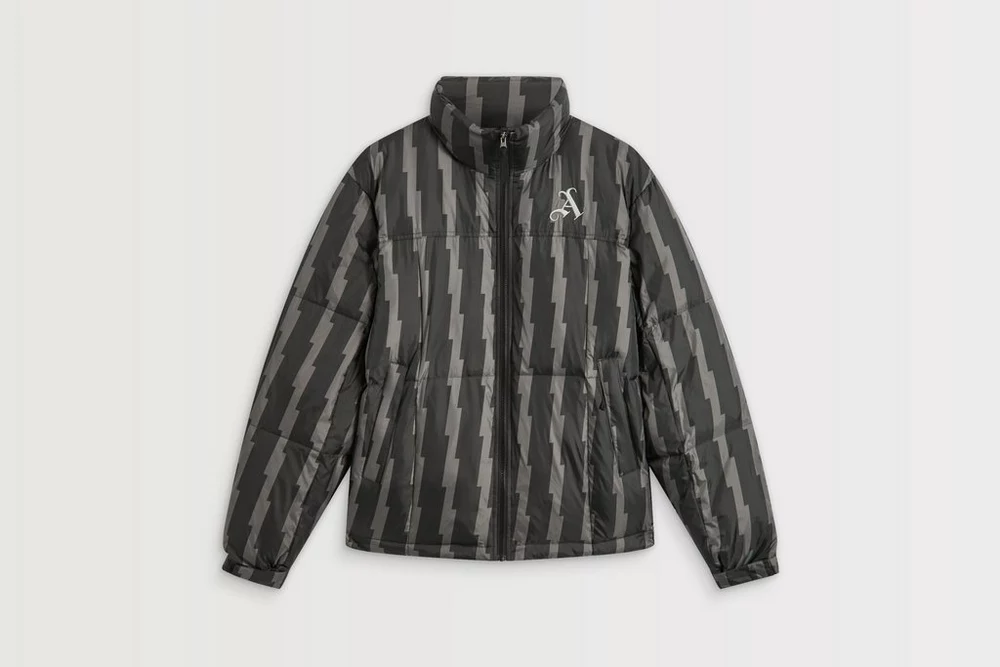 Arsenal Fanshop Store - Arsenal schwarze bedruckte Cannon-Steppjacke Offizielle Arsenal FC Fußballbekleidung